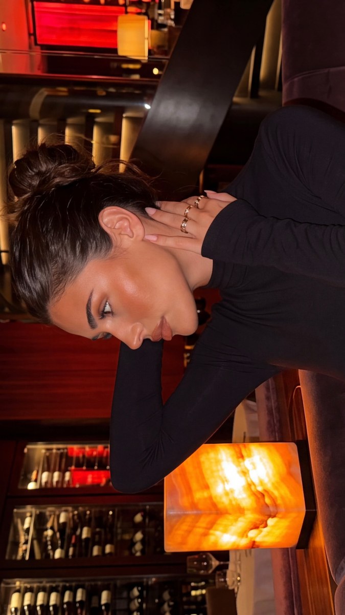 Woman in a Warmly Lit Luxury Restaurant output 2
