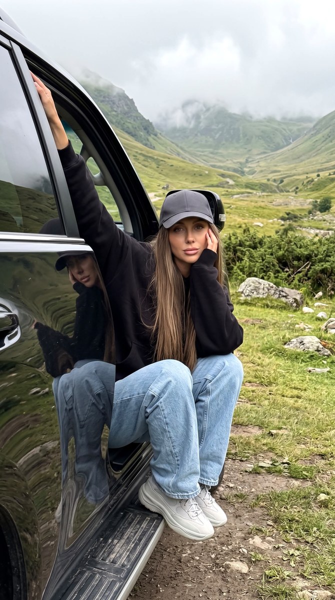 Young Woman in a Foggy Mountain Valley