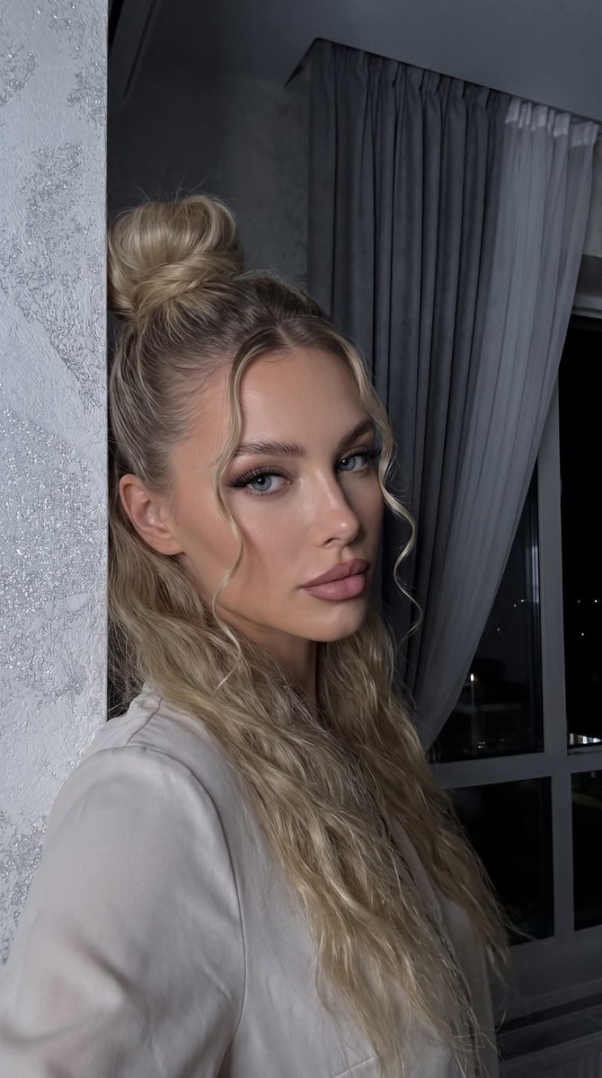 Low-Light Front-Camera Selfie with a High Bun output 2