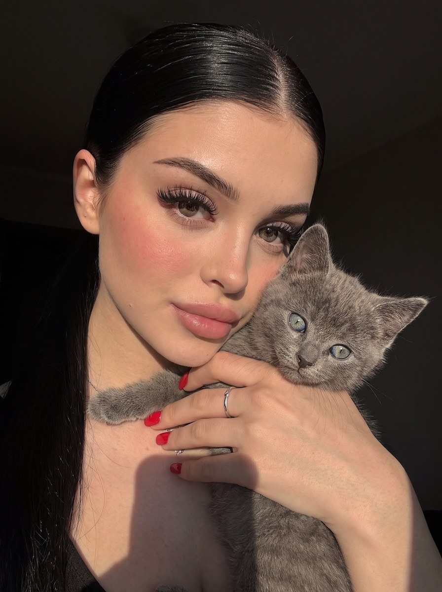 Photorealistic Woman Holding a Kitten Selfie output 1