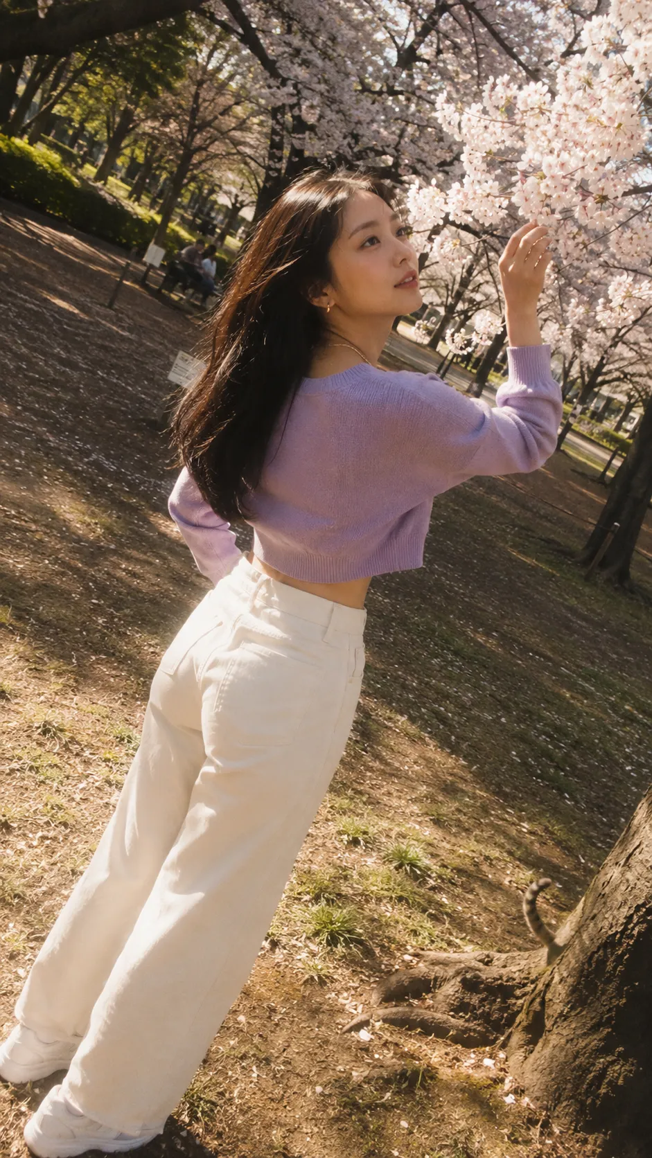 Candid Portrait Reaching for Cherry Blossoms