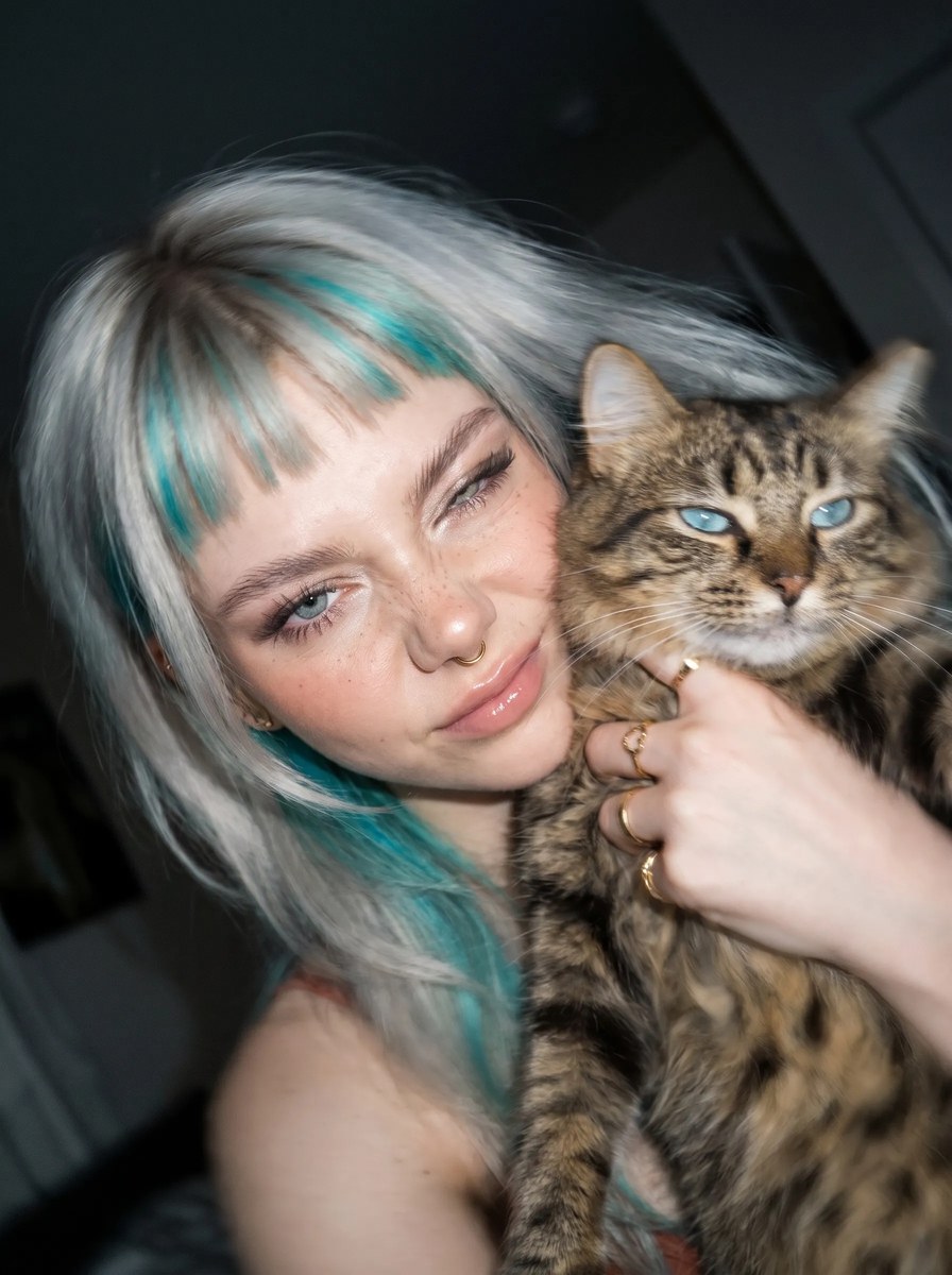 Young Woman Cuddling a Tabby Cat output 13
