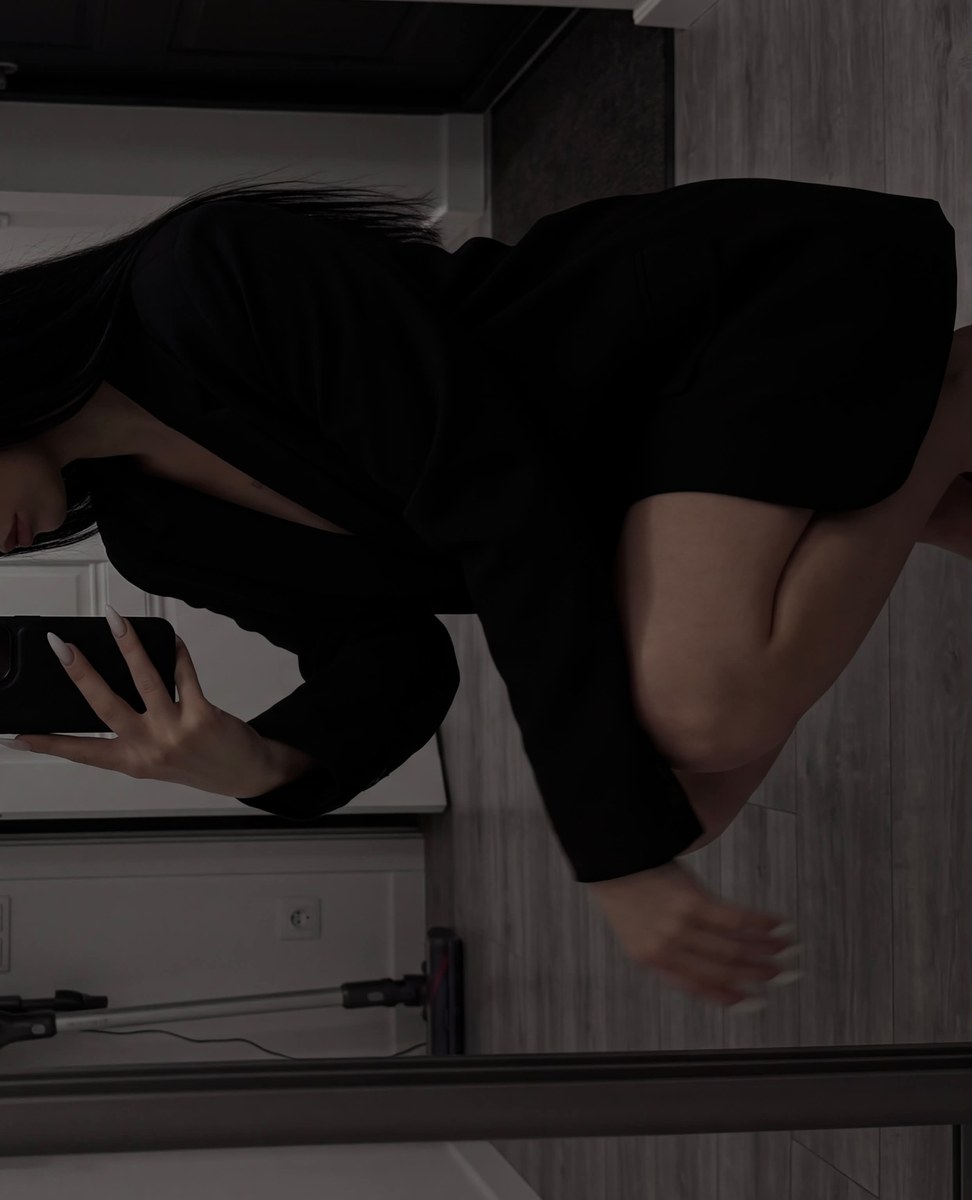 Dark Mirror Selfie in a White Hallway output 2
