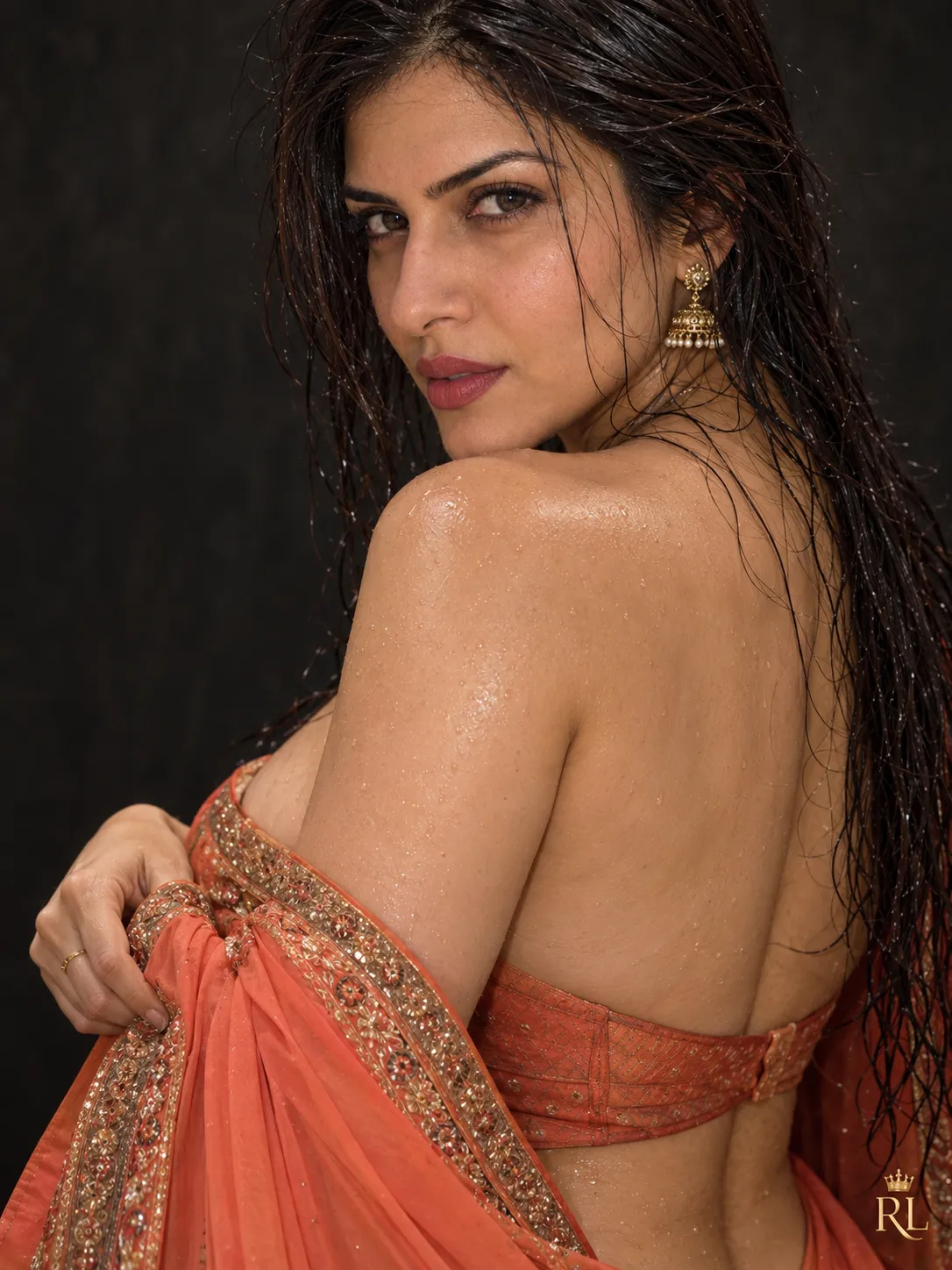 Coral Saree Over-the-Shoulder Studio Portrait