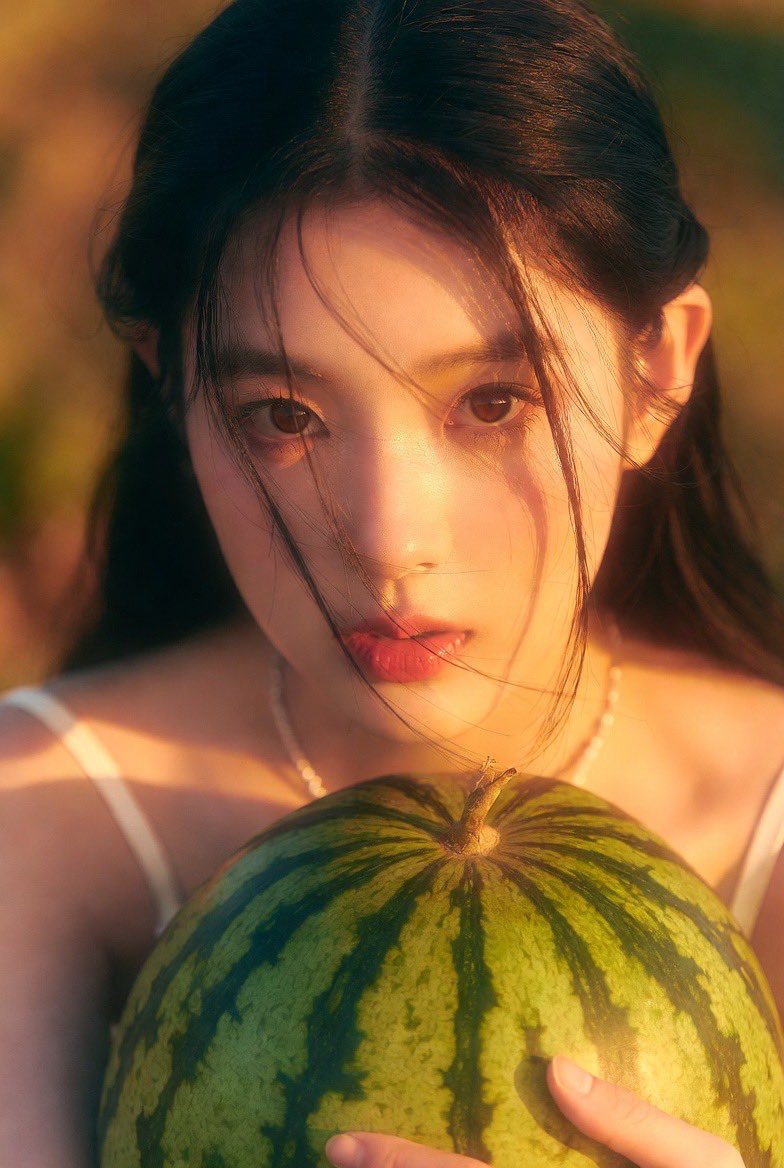 Warm Whimsical Close-Up of a K-Pop Girl with a Watermelon