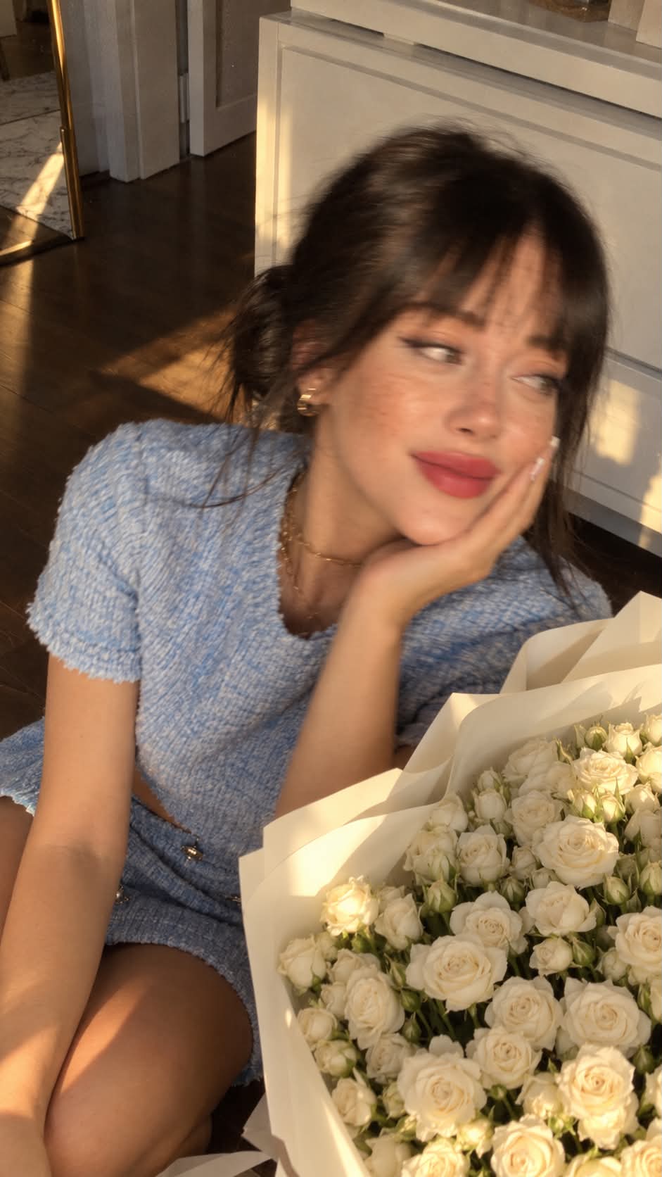Candid Moment with a Bouquet of White Roses output 1