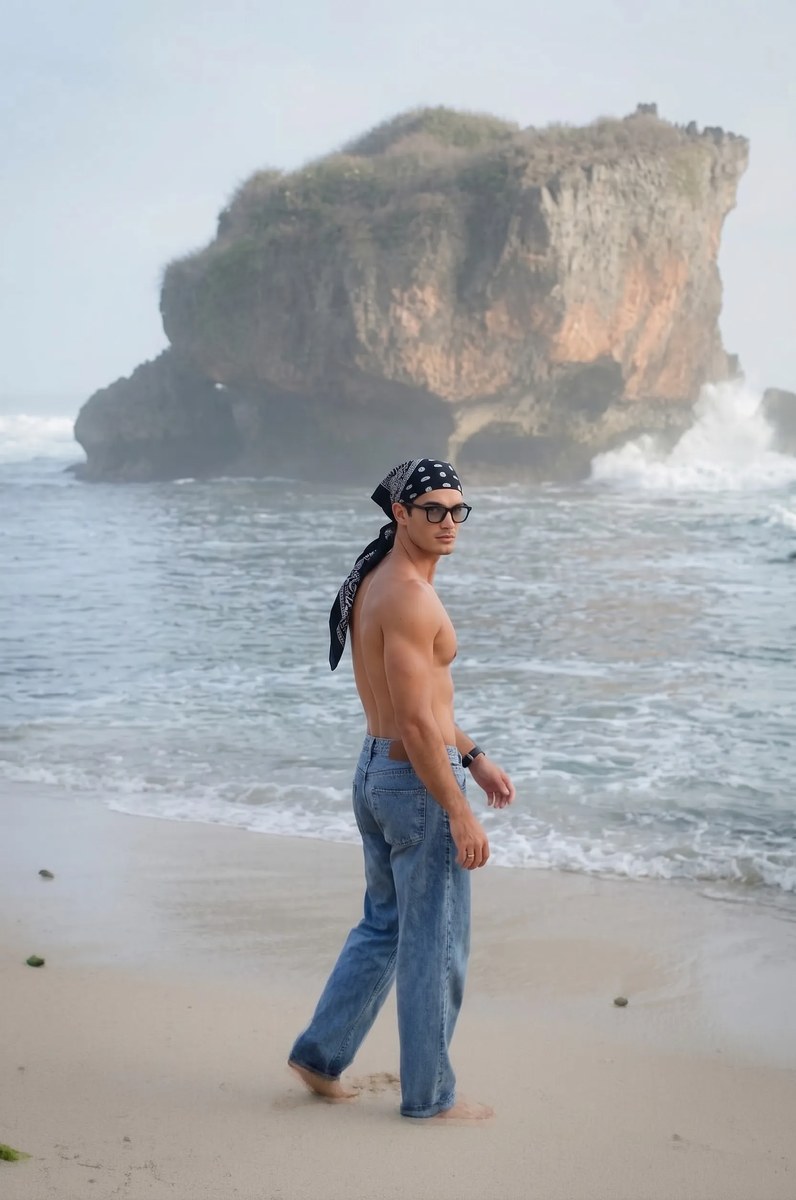 Muscular Young Man on a Rugged Beach