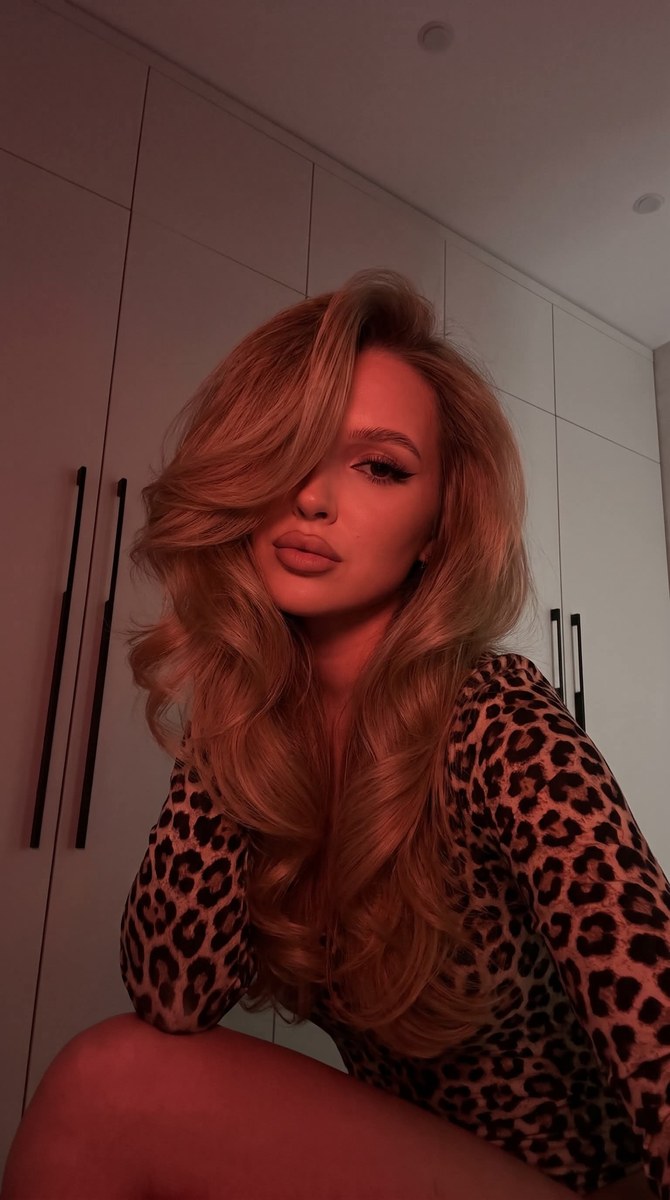 Dark Red-Lit Selfie with Voluminous Hair