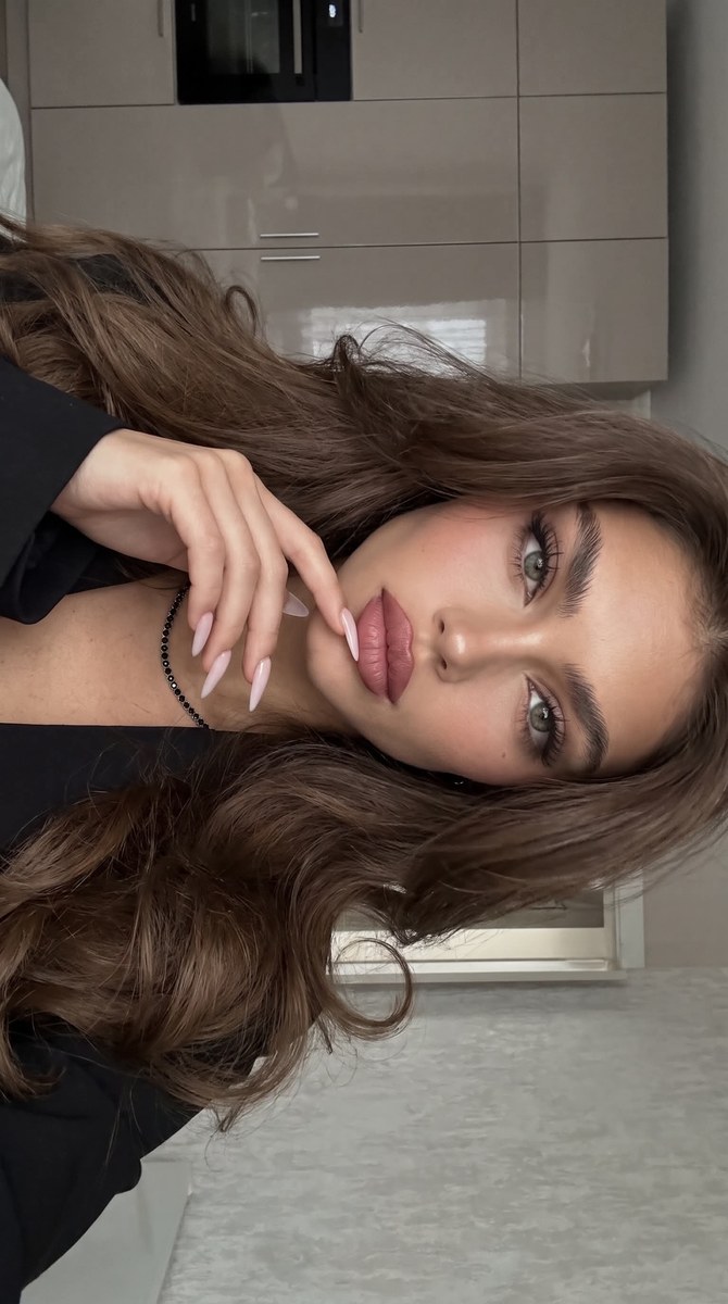 Rotated Low-Light Selfie with Voluminous Hair output 1