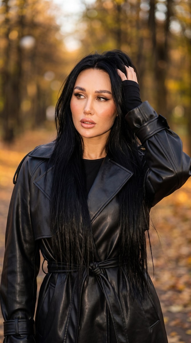 Autumn Fashion Portrait in a Black Leather Trench