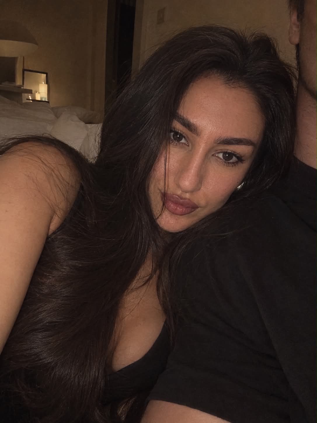 Intimate iPhone Selfie on White Bedding
