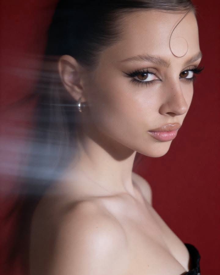 Cinematic Red-Backdrop Fashion Portrait output 2