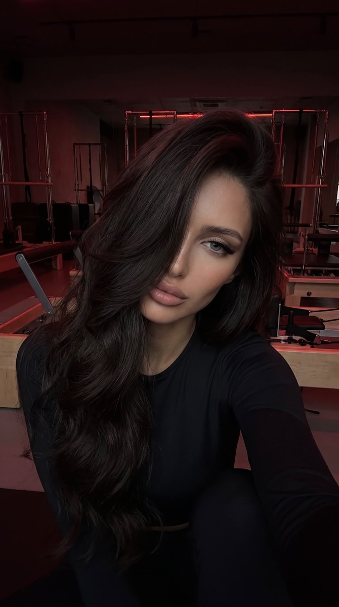 Dark Red-Lit Pilates Studio Selfie