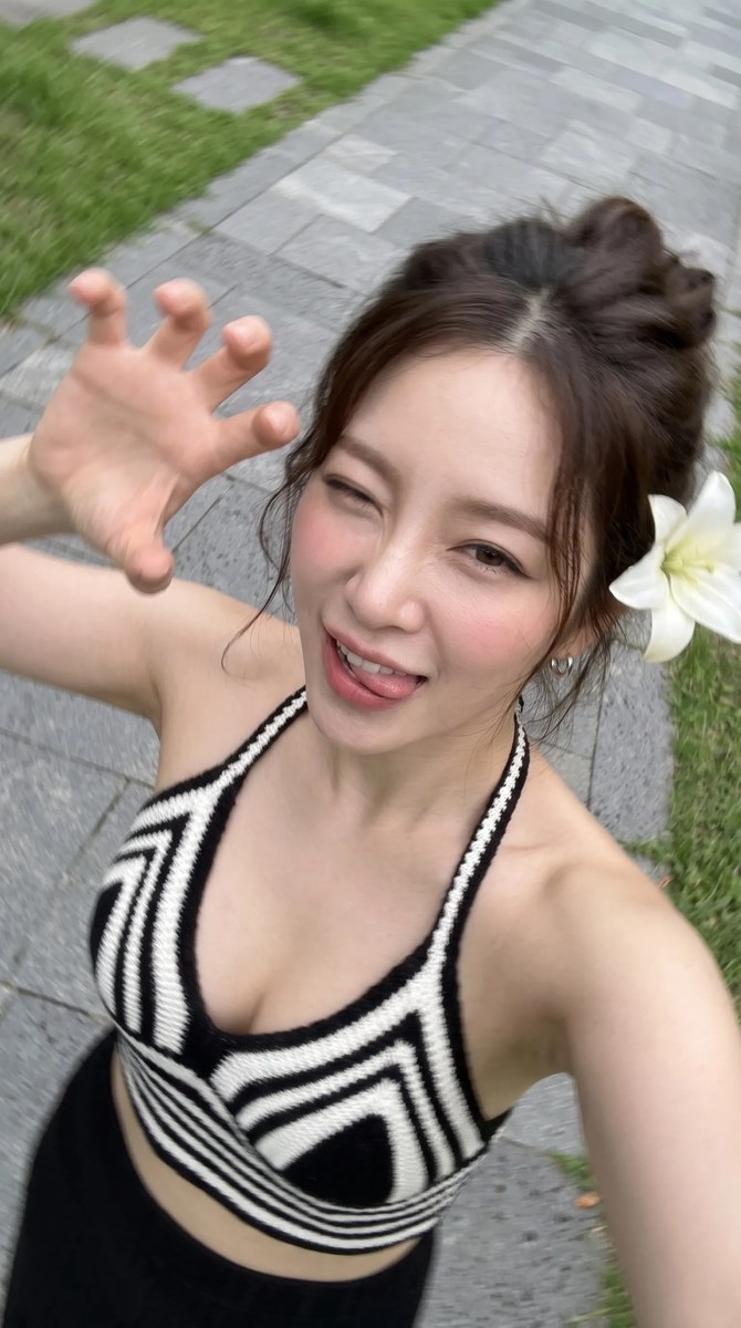 Photorealistic High-Angle Selfie with a Lily in Her Hair output 3
