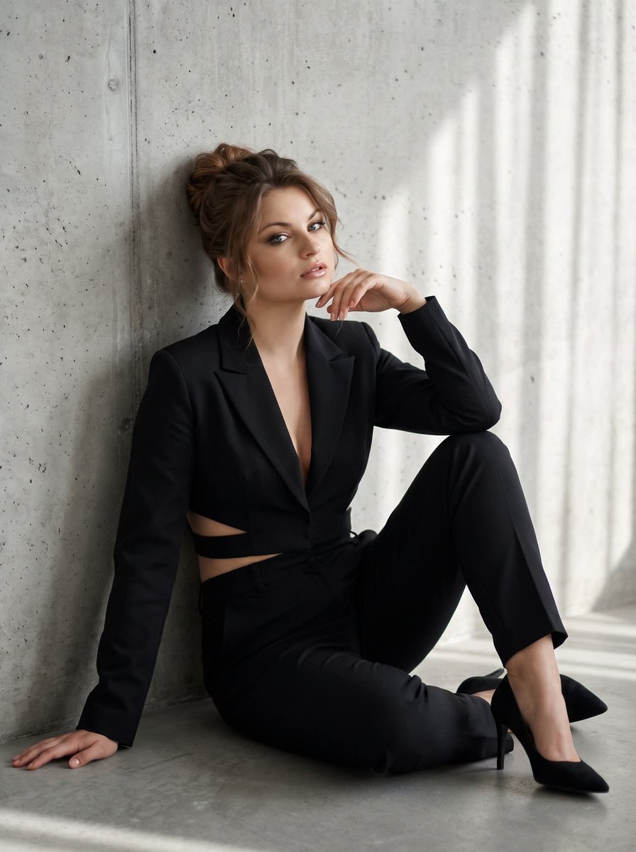 High-Fashion Portrait Against a Concrete Wall