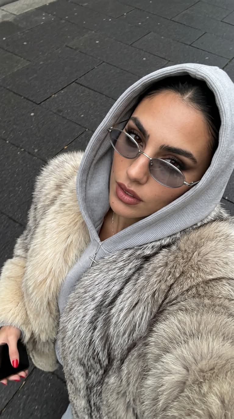 High-Angle Candid Selfie in Oversized Fur