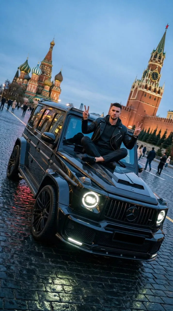 Low-Angle G63 Lotus-Pose Portrait on Red Square