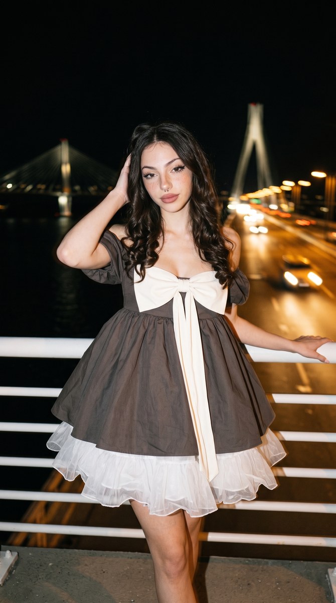 Nighttime Fashion Portrait by an Illuminated Bridge