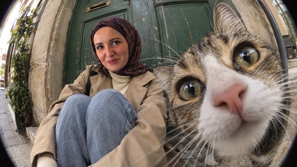 Fisheye Portrait of a Woman and Cat on a Doorstep