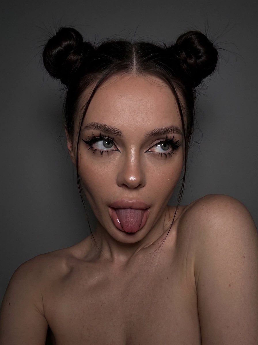 Dark Studio Selfie with Playful Space Buns