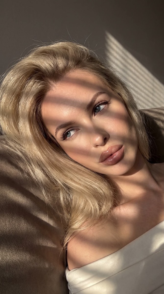 Sunlit Close-Up Selfie with Diagonal Blind Shadows
