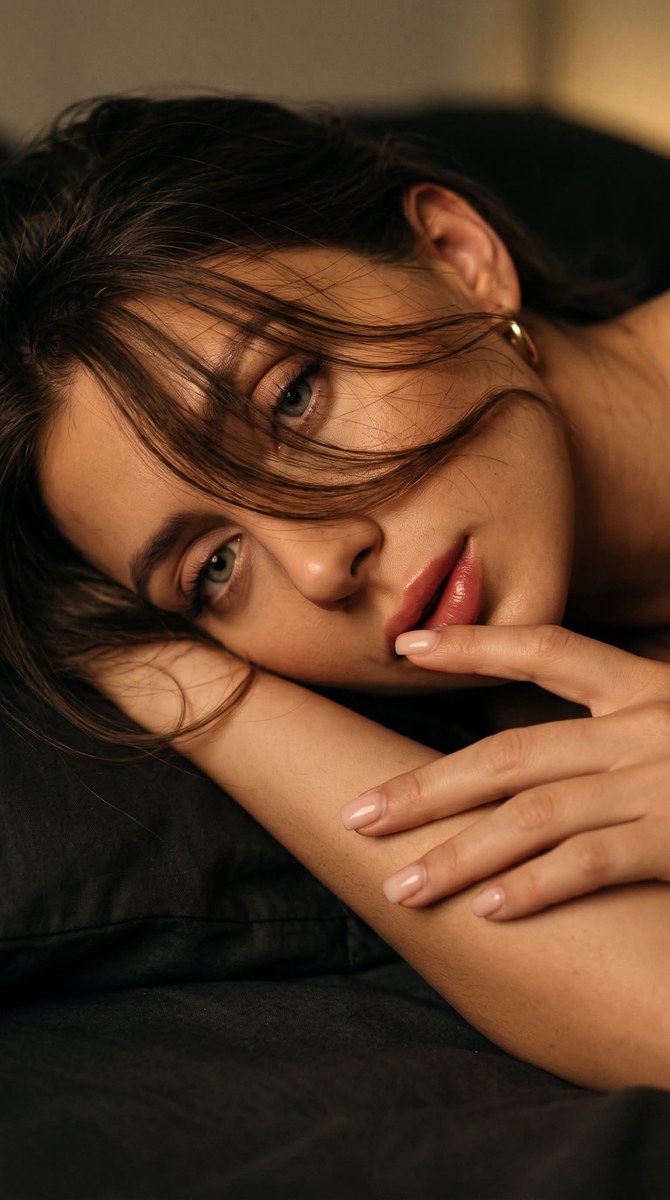 Low-Key Close-Up Portrait of a Young Woman