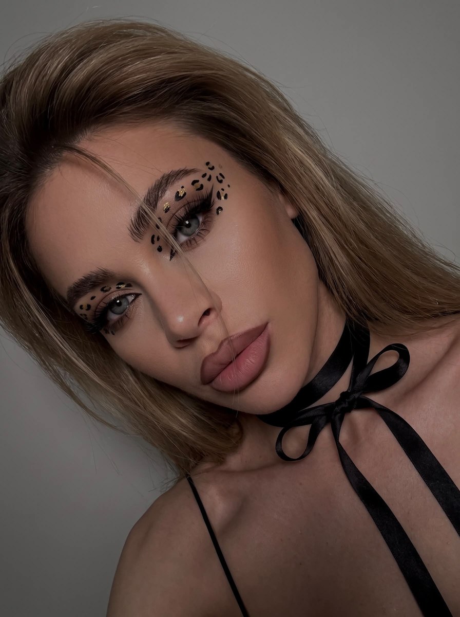 Extreme Close-Up Leopard-Eye Makeup Selfie output 1