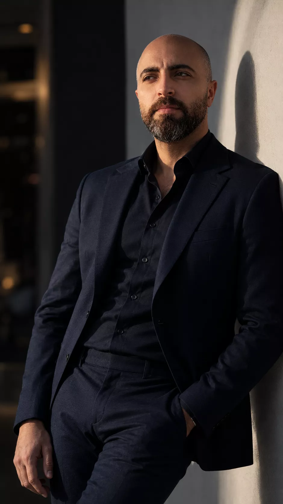 Side-Lit Portrait of a Man in a Dark Blue Suit