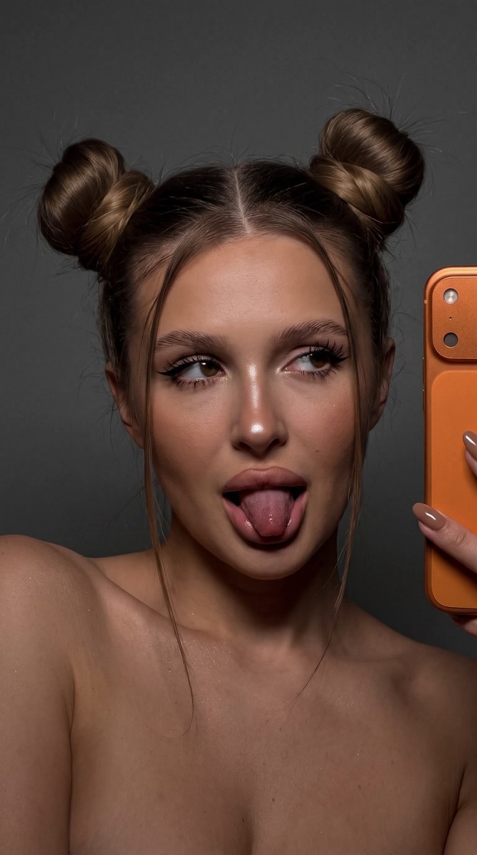 Dark, Playful iPhone Selfie with Double-Bun Hair output 2