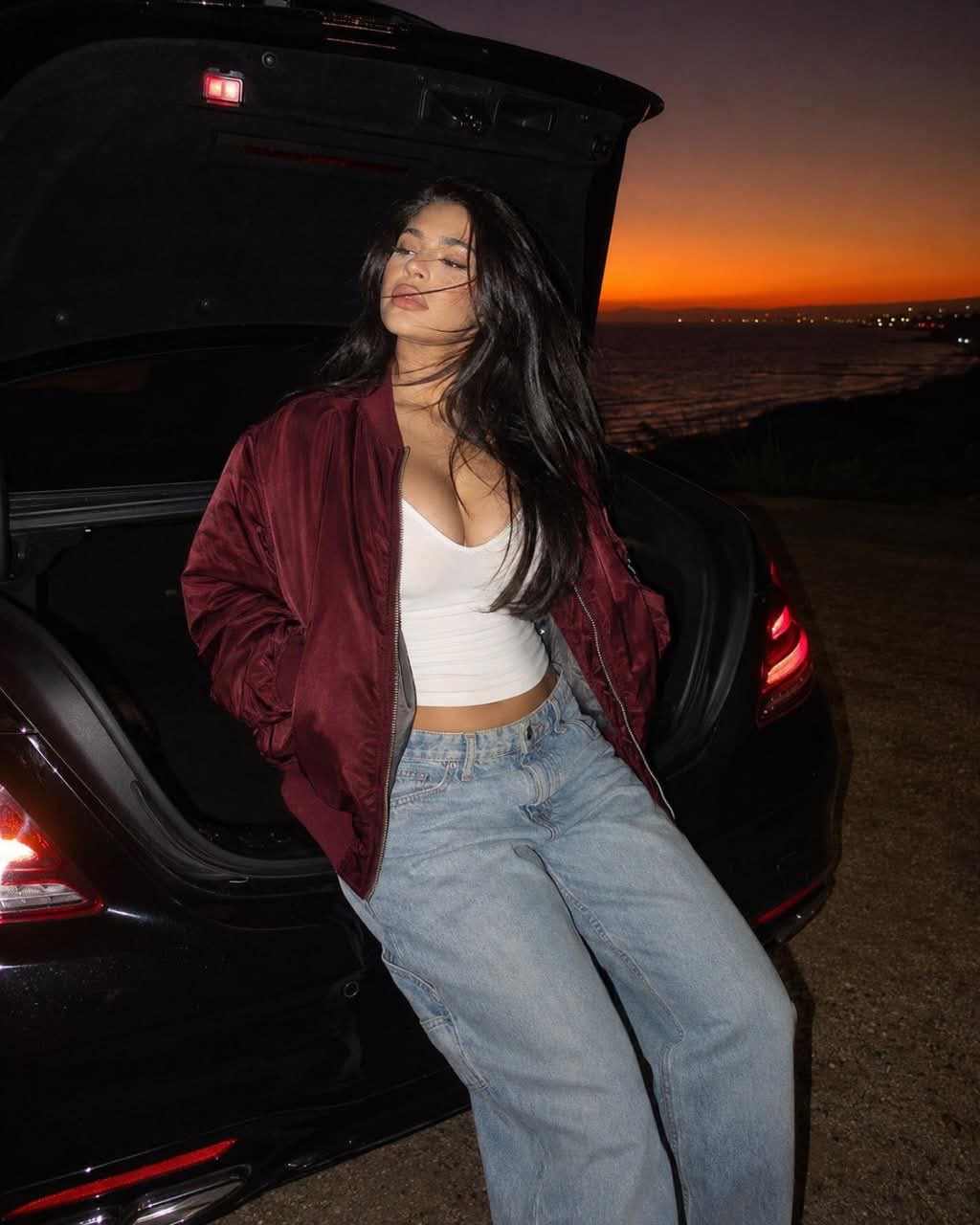 Nighttime Seaside Portrait by an Open Mercedes Trunk