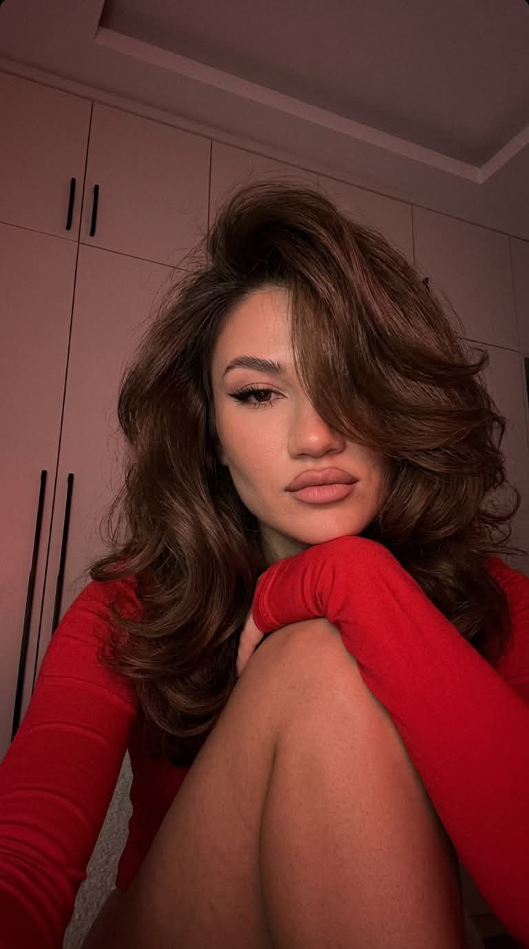 Low-Light Red-Lit Selfie with a Voluminous Blowout