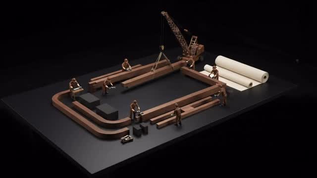 Miniature Craftsmen Assemble a Luxury Sofa