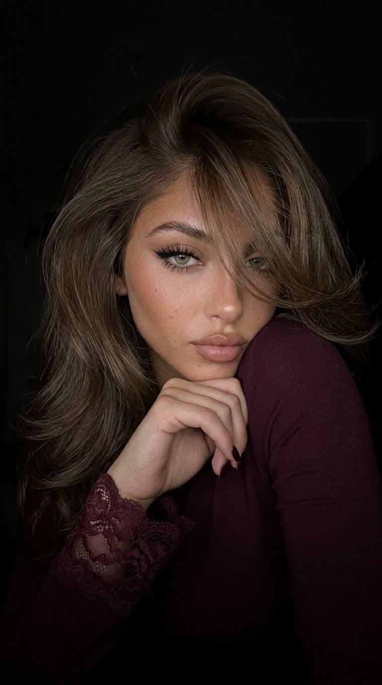Low-Light Burgundy Selfie Portrait