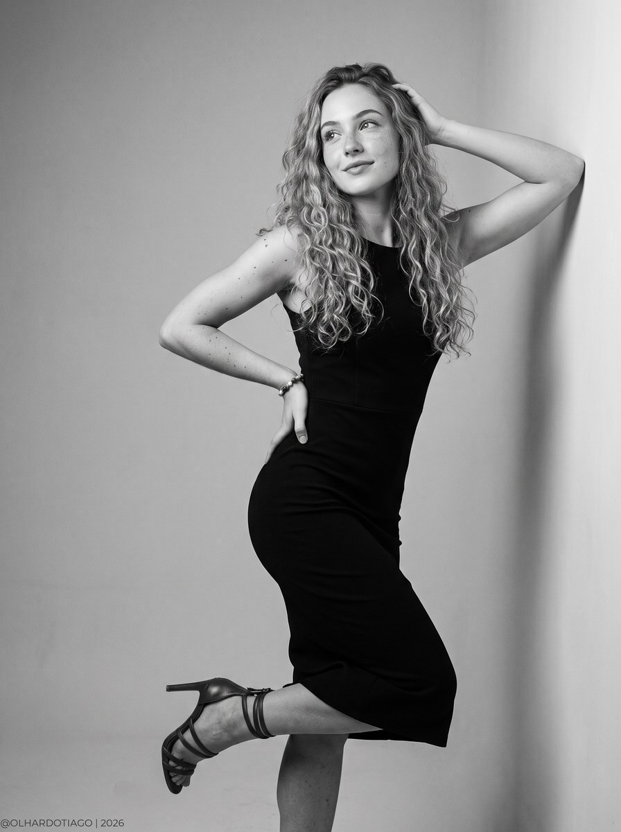Black-and-White Studio Portrait with Dynamic Pose