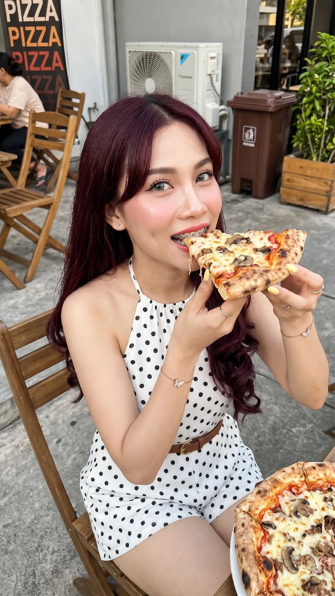 Young Woman Eating Pizza at an Outdoor Restaurant output 4