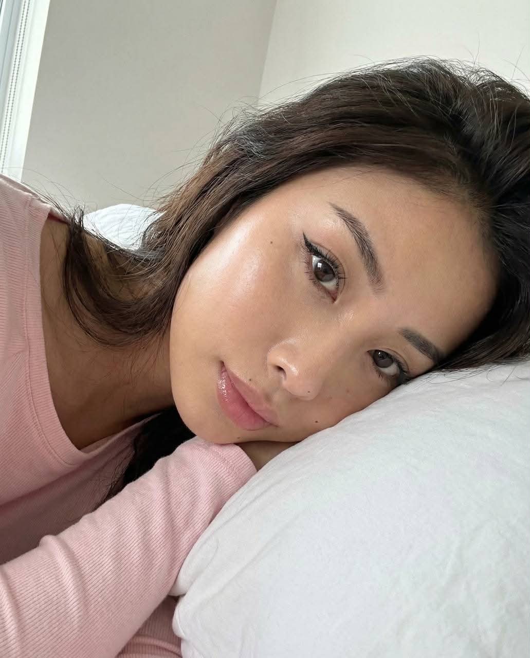 Realistic Close-Up Portrait on a White Pillow output 2