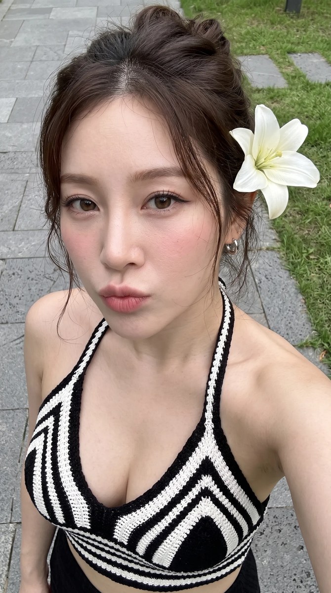 Photorealistic High-Angle Selfie with a Lily in Her Hair