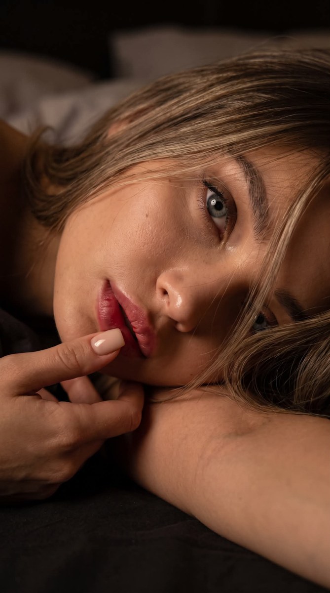Low-Key Hyperrealistic Portrait of a Young Woman