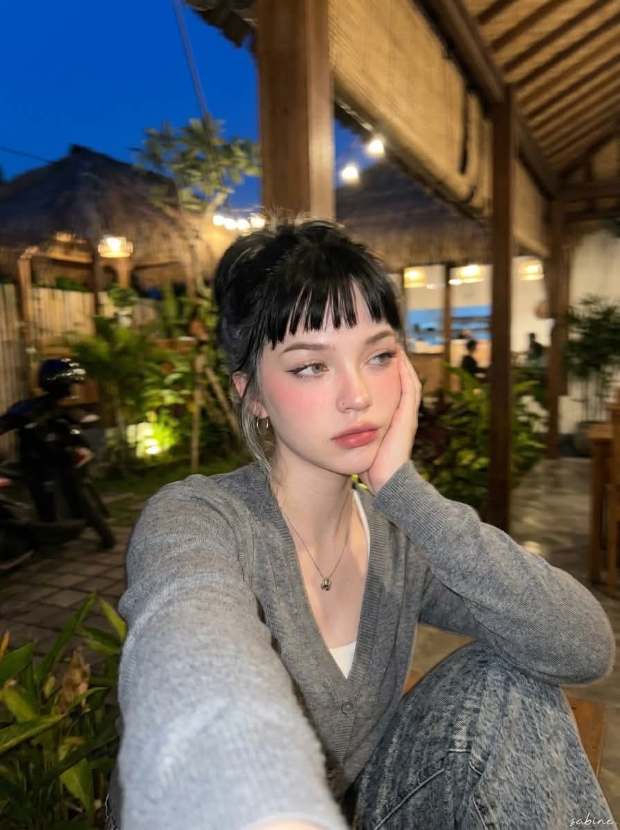 Candid Nighttime Portrait at a Rustic Tropical Café output 9