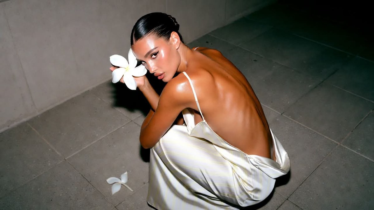 Candid Luxury Resort Portrait with a Draped-Back Dress output 2
